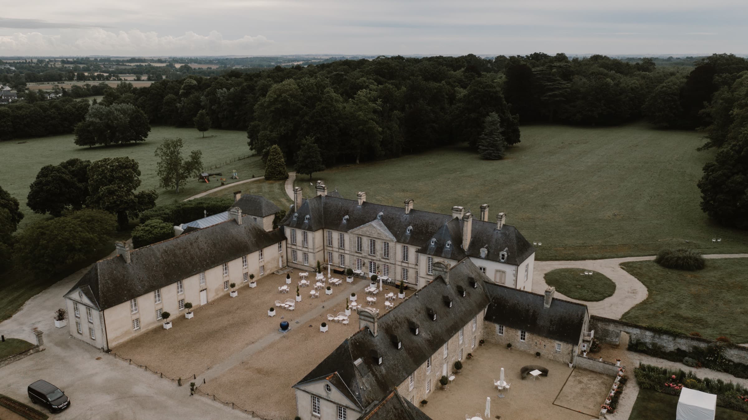 A grand French château estate seen from the air