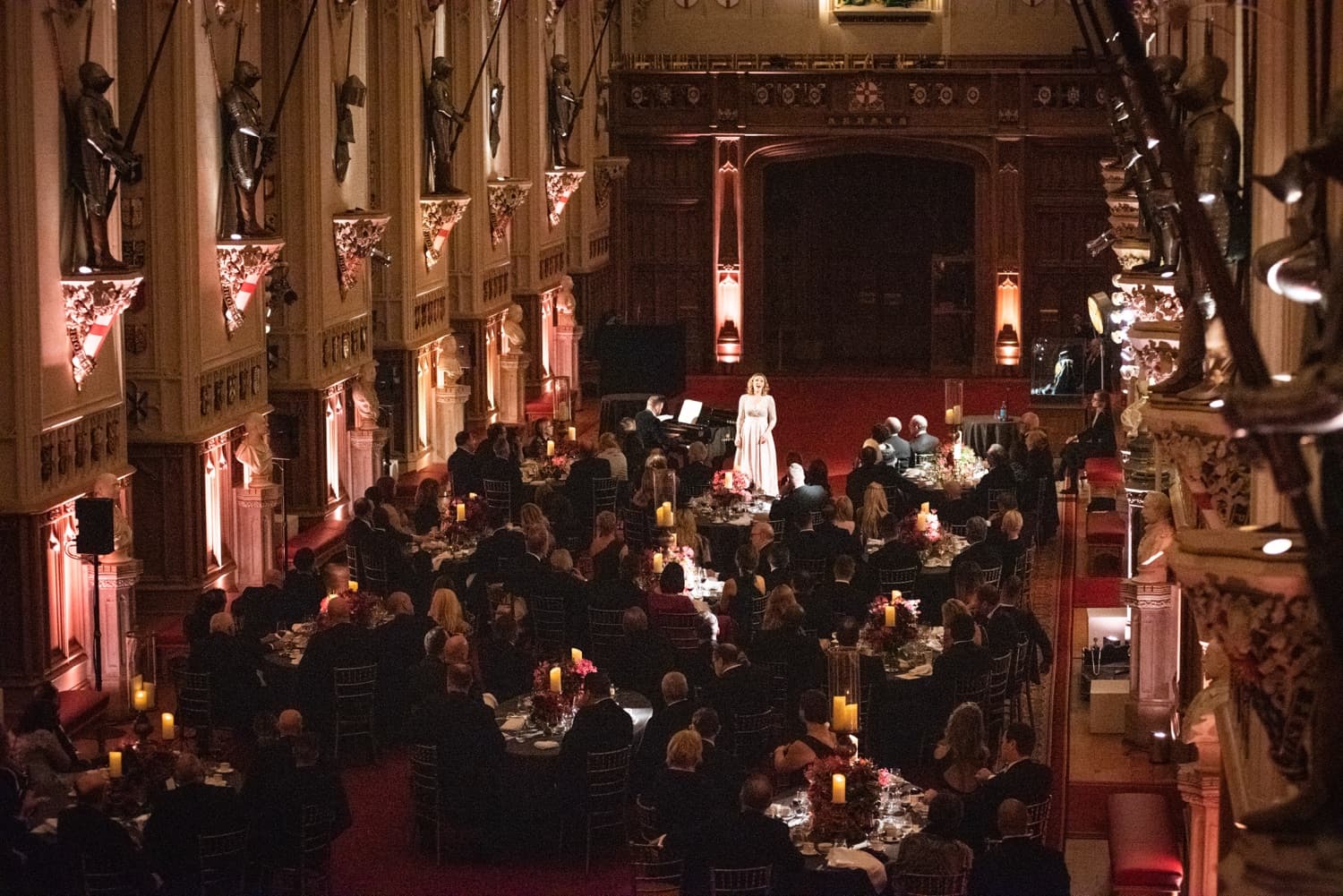 A gala dinner filling a grand historic hall
